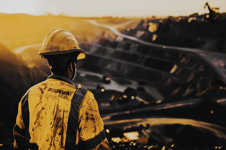Open-pit mining operation at dusk